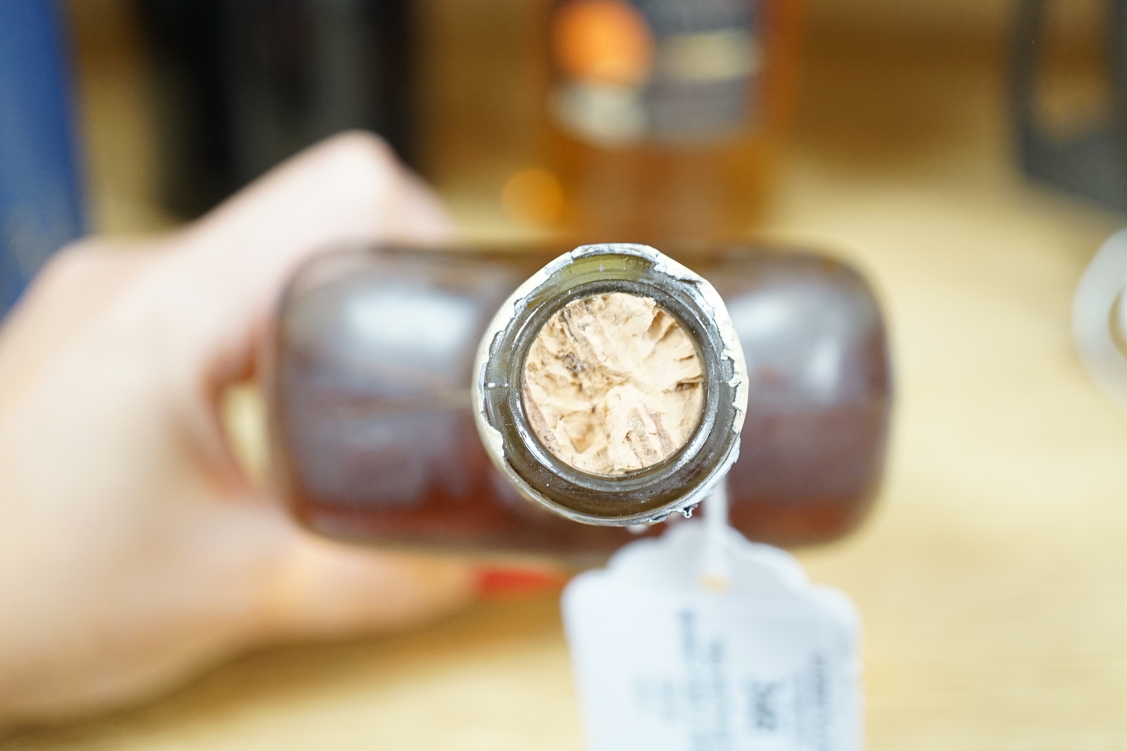 Two bottles of whisky and a John Jameson & Sons bottle